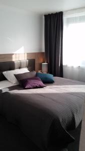 Postel nebo postele na pokoji v ubytování APPART-HOTEL, Einsteinstraße
