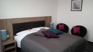Postel nebo postele na pokoji v ubytování APPART-HOTEL, Einsteinstraße