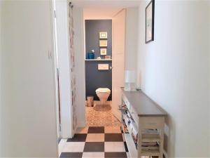 a hallway with a bathroom with a toilet in it at Maison La Baule, 6 pièces, 8 personnes - FR-1-392-174 in La Baule