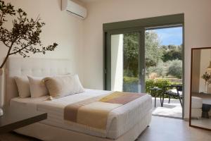 Postel nebo postele na pokoji v ubytování Arbora Olea Luxury Resort