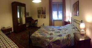 a bedroom with a bed and a table in it at L'Angolo Divino in Casella