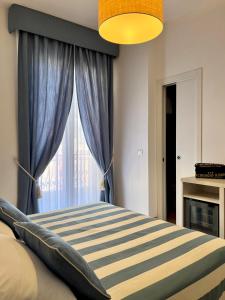 a bedroom with a bed and a window at Albergo Degli Amici in Monterosso al Mare