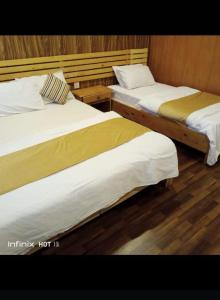 Voodi või voodid majutusasutuse Indus View Hotel Skardu toas