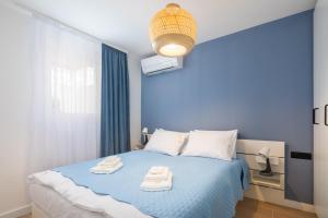 Postel nebo postele na pokoji v ubytování Kovač Family Suites
