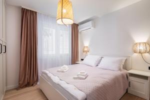 Postel nebo postele na pokoji v ubytování Kovač Family Suites