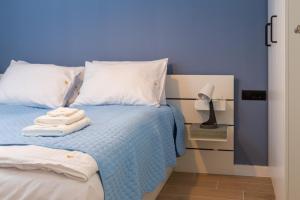 Postel nebo postele na pokoji v ubytování Kovač Family Suites