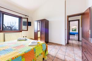 a bedroom with a bed and a large window at Villa Rita in Racale +36 photos