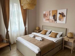 a bedroom with a large bed in a room at Apartments Marilu in Kotor