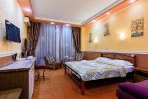 Postel nebo postele na pokoji v ubytování Tiso Apart Hotel