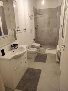 a bathroom with a toilet and a sink and a shower at Ak Holidays Apartment 59 in Bologna