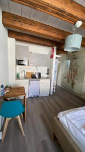 Eldhús eða eldhúskrókur á Aux chambres du Banneret