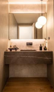 a bathroom with a sink and a mirror at Villa Sofia Cascais in Cascais