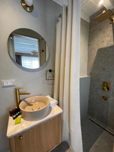 a bathroom with a sink and a shower at Monk Hotel Alaçatı in Alacati