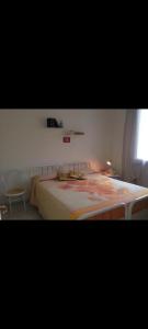 A bed or beds in a room at La Curte