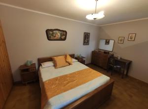 Un pat sau paturi într-o cameră la Agriturismo Ribuntà