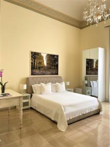 Postel nebo postele na pokoji v ubytování Armonia B&B