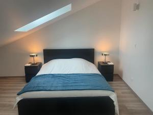 Posteľ alebo postele v izbe v ubytovaní Duplex By Aurelle 1