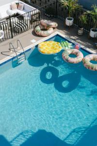 a swimming pool with inflatables in the middle at The Shore House in Wildwood