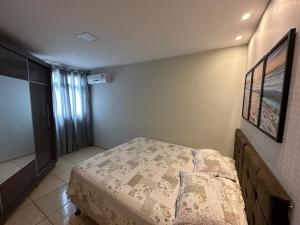 Ein Bett oder Betten in einem Zimmer der Unterkunft Double Beach - Um cantinho inesquecível da Praia do Morro, lugar de tranquilidade e mar calmo
