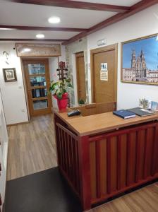 an office with a reception desk in a room at LAST 12K in Santiago de Compostela