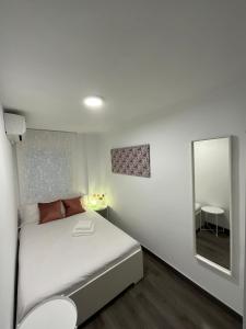 Posteľ alebo postele v izbe v ubytovaní HEROE APARTAMENTO