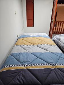 a large bed sitting in a room with at COZZY APARTMENT IN AYACUCHO in Ayacucho