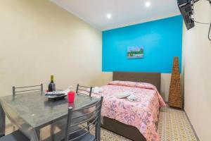 A bed or beds in a room at Eracles House near Ortigia Island