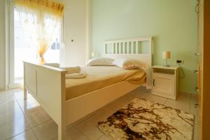 Postel nebo postele na pokoji v ubytování Kyriakos Apartment