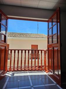 an open balcony with a view of a building at Cozzy apartment en pleno Centro! in Ayacucho