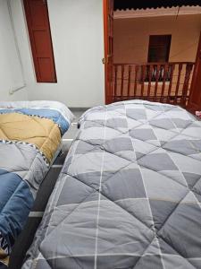 En eller flere senge i et værelse på Cozzy apartment en pleno Centro!