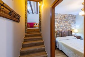 Postel nebo postele na pokoji v ubytování Casa Dieste Apartamentos Turísticos en Boltaña