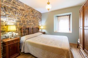 Postel nebo postele na pokoji v ubytování Casa Dieste Apartamentos Turísticos en Boltaña