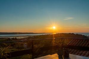 a view of the sunset from the balcony of a house at LaraBella Salt fields view studio in Portorož