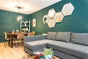 a living room with a couch and a table at Cosy and modern apartment in the heart of Dublin in Dublin