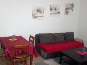 a living room with a couch and a table at Apartmán Štefánikova in Zlín