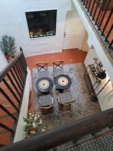 an overhead view of a table and chairs in a house at Hôtel Le Patio de Sophie in Sisteron