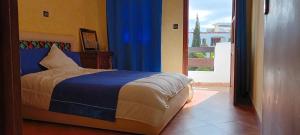 Postel nebo postele na pokoji v ubytování Complexe Mouna Cabo Negro