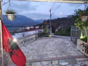 a view from the balcony of a house with a flag at Guest House Bake in Gjirokastër