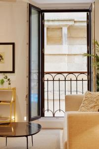 A bed or beds in a room at 8 balconies Heart of the old town