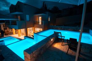 The swimming pool at or close to Dimani Suites