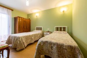 Postel nebo postele na pokoji v ubytování Casa Dieste Apartamentos Turísticos en Boltaña