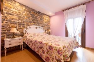 Postel nebo postele na pokoji v ubytování Casa Dieste Apartamentos Turísticos en Boltaña