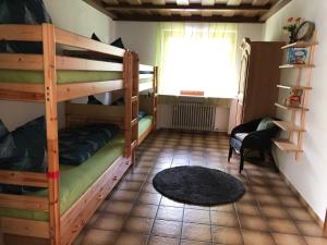 a room with two bunk beds and a window at Ferienhaus am Kienberg in Pfronten