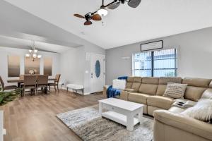 a living room with a couch and a table at Blue Lagoon in Tampa