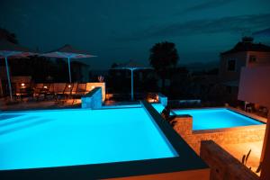The swimming pool at or close to Dimani Suites
