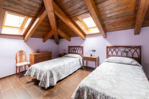 Postel nebo postele na pokoji v ubytování Casa Dieste Apartamentos Turísticos en Boltaña