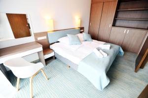 Ένα ή περισσότερα κρεβάτια σε δωμάτιο στο Baltic Plaza Resort +32 φωτογραφίες