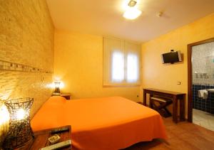 Postel nebo postele na pokoji v ubytování Hostal Rural El Tejar