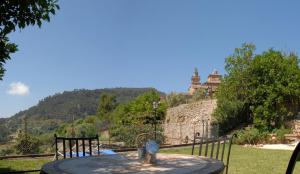 a large stone building with a clock on top of it at Hotel Sa Vall in Valldemossa