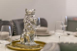 a crystal vase with a crown on a table with glasses at 412 Roman Bank in Ingoldmells